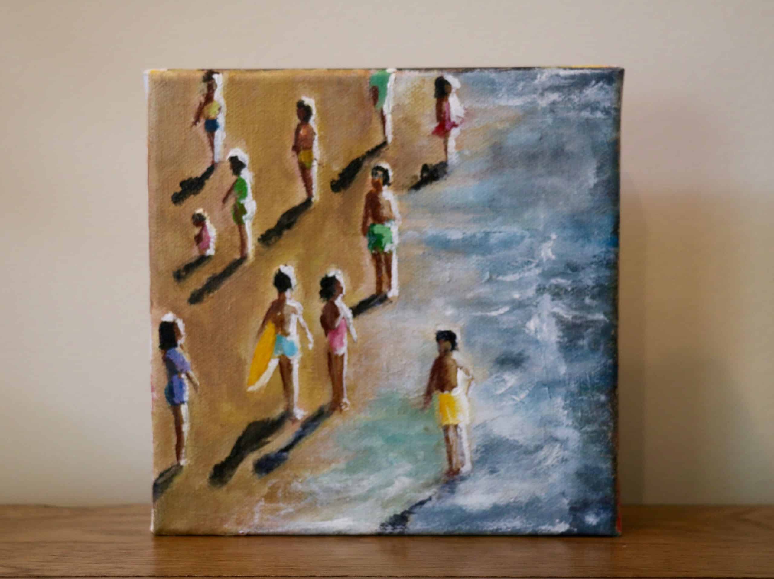 A painting of people on a beach.